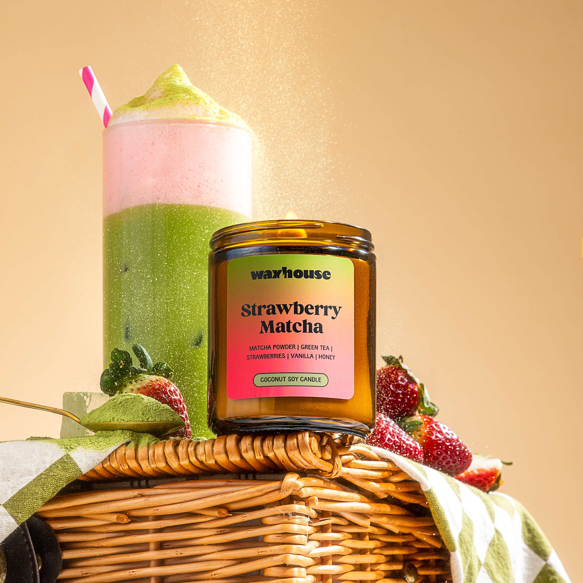 Waxhouse Strawberry matcha candle sitting on styled background