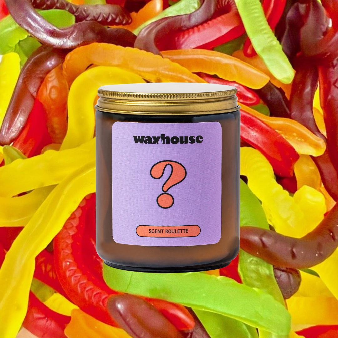Waxhouse scent roulette surrounded by colorful snake lollies